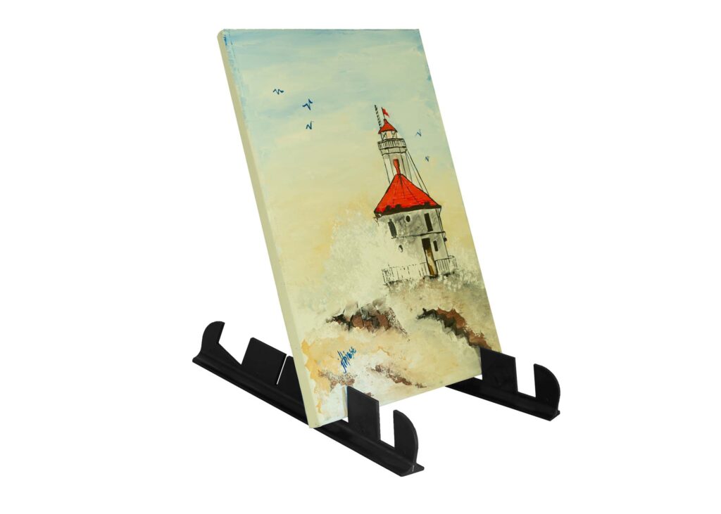 Small castle painting on a tabletop easel